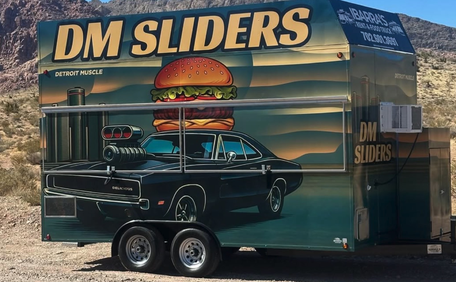 DM Sliders trailer in the desert, Detroit Muscle wrap across the side